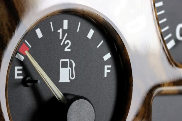 Fuel gauge on car dashboard - almost empty