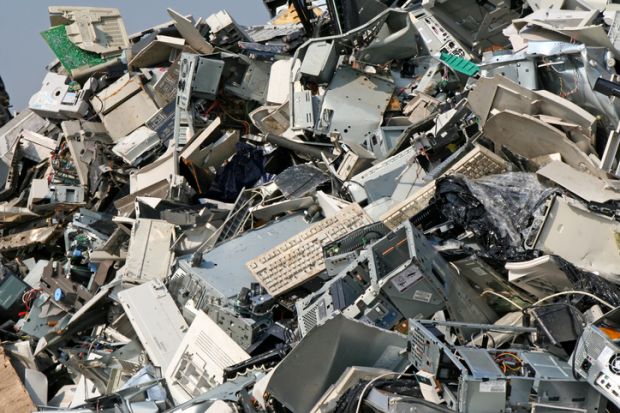 Heap of discarded computer parts in a dump