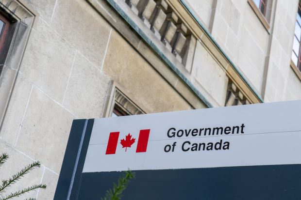 Government of Canada sign outside the office building in Ottawa, Ontario, Canada.
