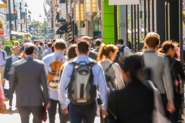 Commuters and pedestrians on busy pavement, Central Manhattan, New York, USA Commuters and pedestrians on busy pavement, Central Manhattan, New York, USA