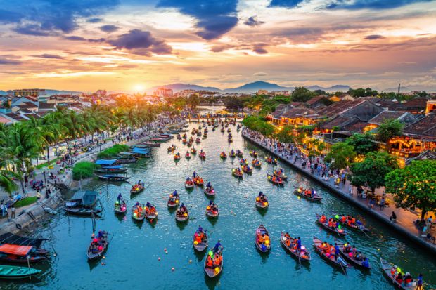 Aerial view of the ancient Vietnamese town Hoi An at twilight