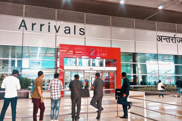 People waiting at arrival at Delhi IGI IndiaAirport, India