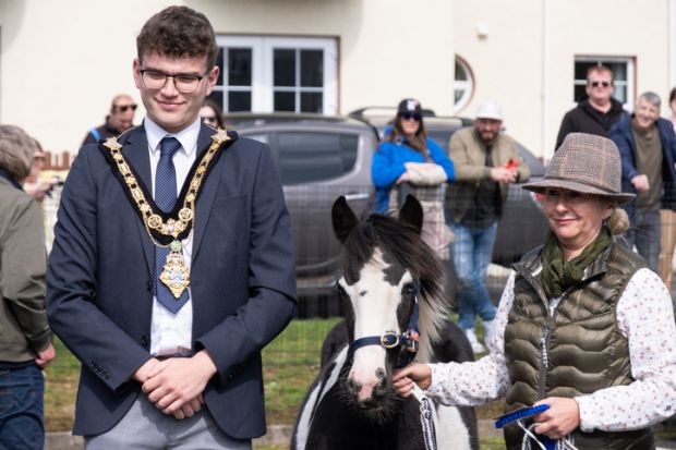 Councillor Ciarán McQuillan Mayor of Causeway Coast and Glens poses with female competitor in annual Lammas Fair Heavy Horse show. Councillor Ciarán McQuillan Mayor of Causeway Coast and Glens poses with female competitor in annual Lammas Fair Heavy Horse show.