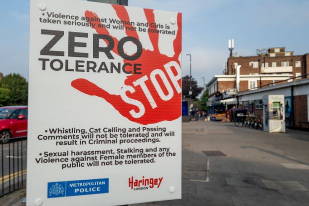 A police and local government street sign informing people of their zero tolerance policy of violence and harassment of women