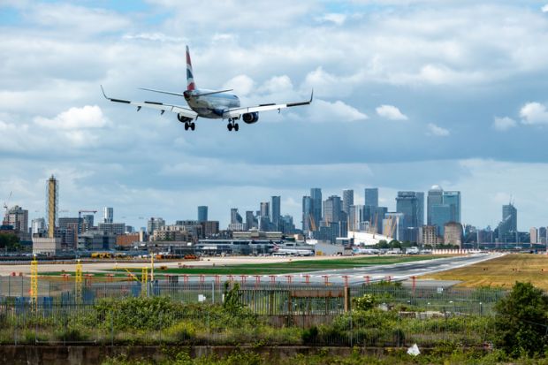 An airplane landing at London City Airport An airplane landing at London City Airport