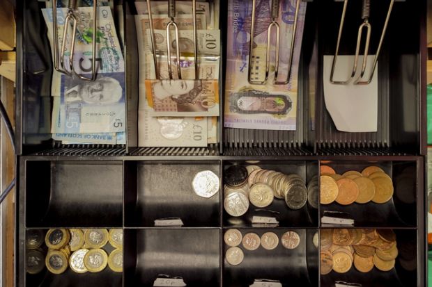 English and scottish banknotes money at till in glasgow 