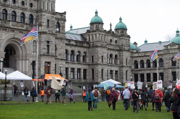Participants in an Idle No More rally march towards the British Columbia Legislative Building Participants in an Idle No More rally march towards the British Columbia Legislative Building