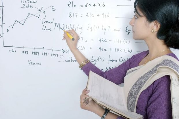Indian professor teaching in classroom