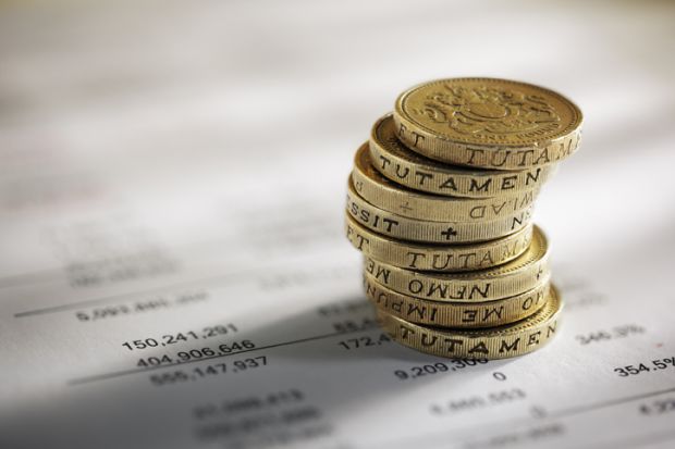 British pounds next to household bill