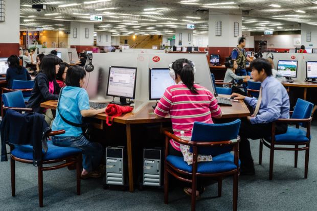 People searching information on internet in National Taiwan Library. People searching information on internet in National Taiwan Library.