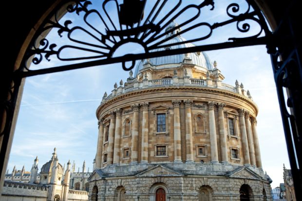 A view of the Radcliffe Camera through a gate at the University of Oxford A view of the Radcliffe Camera through a gate at the University of Oxford in England