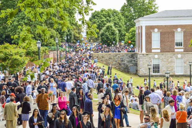 Crowd of people walking by amphitheater at graduation ceremony at University of Virginia Crowd of people walking by amphitheater at graduation ceremony at University of Virginia