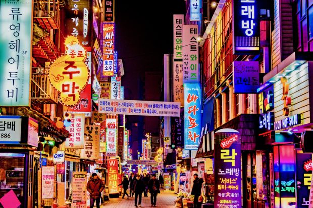 Road with bright neon signs in Seoul