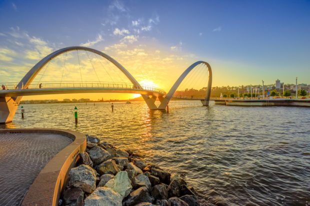 Elizabeth Quay Bridge at sunset light on Swan River at entrance of Elizabeth Quay marina in Perth