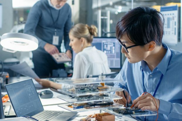 Computer scientist researching in their laboratory Computer scientist researching in their laboratory