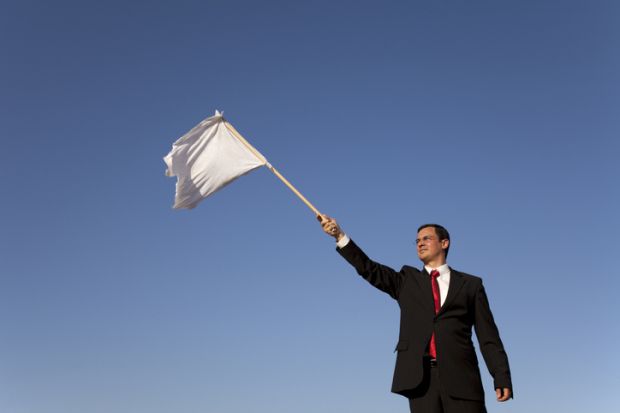Man waving a white flag