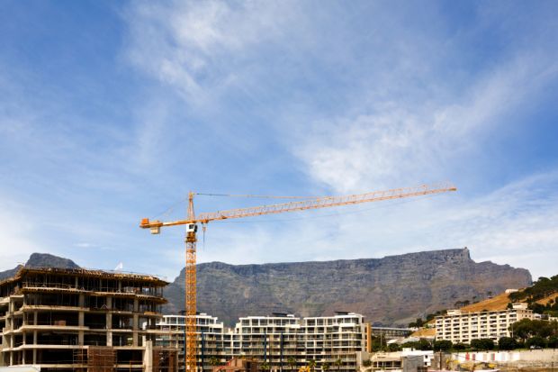 Table Mountain behind a construction site in Cape Town, South Africa Table Mountain behind a construction site in Cape Town, South Africa