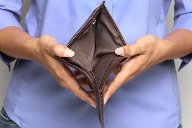 Person holding an empty wallet