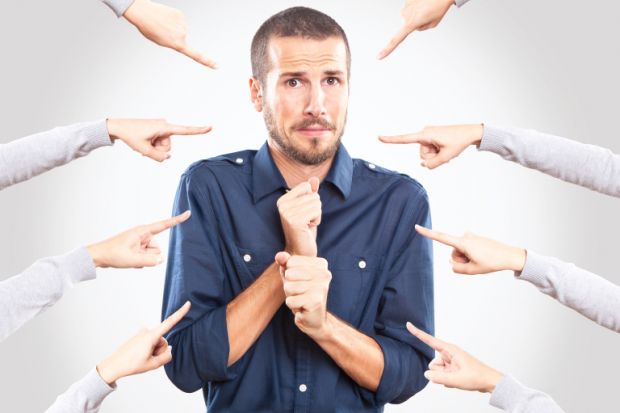 Young man being pointed at