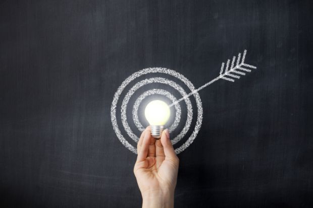 Arrow hitting a lightbulb