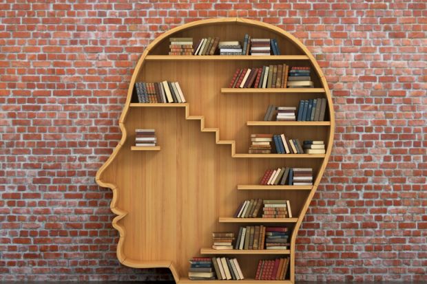 Books on head-shaped shelving