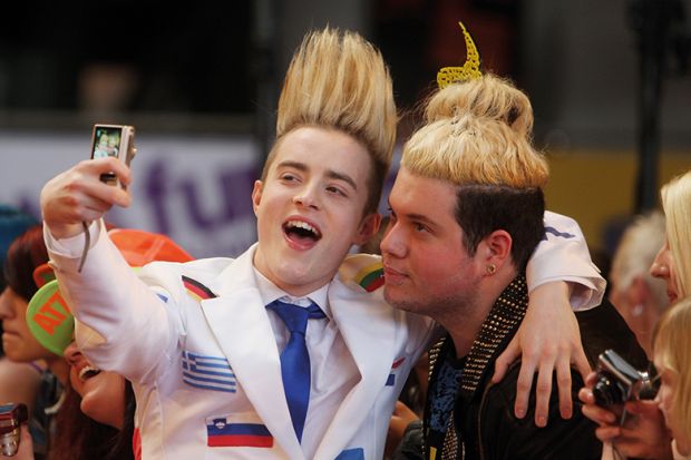 Jedward taking a selfie with a fan Jedward taking a selfie with a fan illustrating the academic star system