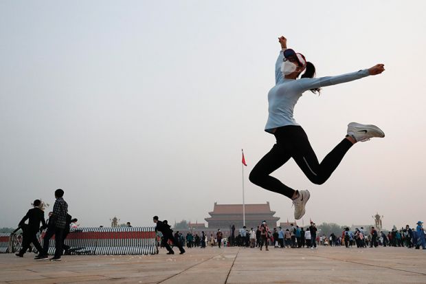 Woman leaps in Chinese city Woman jumps in Chinese city