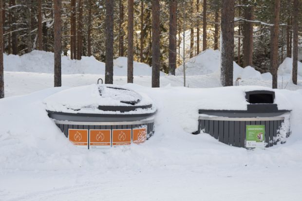 Finland public trash covered by snow Kittila, Finland - Feb 23, 2020 Finland public trash covered by snow.