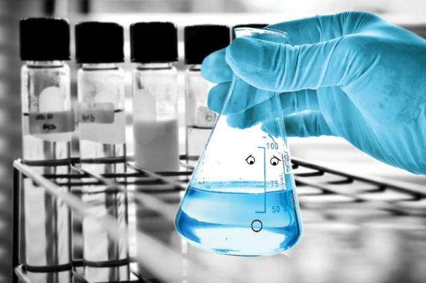 Laboratory beaker with face and suprised expression