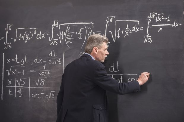 Lecturer in front of blackboard