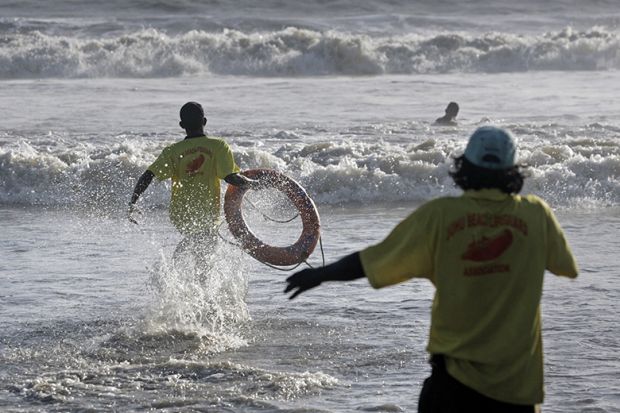 Life guards demonstrate the skill of saving lives at Juhu Beach, Mumbai