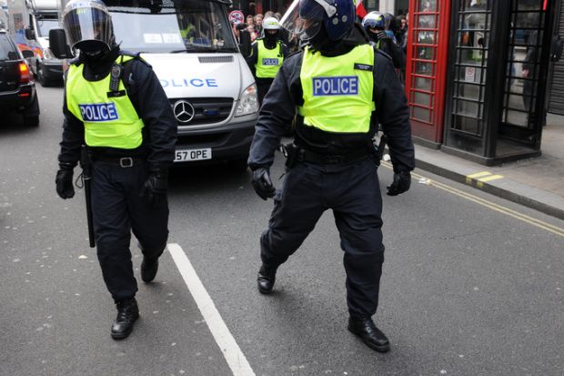 London, UK - March 26, 2011 Police in riot gear advance through central London during a large anti-cuts rally on March 26, 2011 in London, UK.