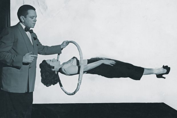 Magician performing gravity-defying trick