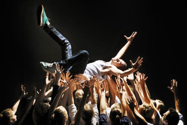 Man being carried by group