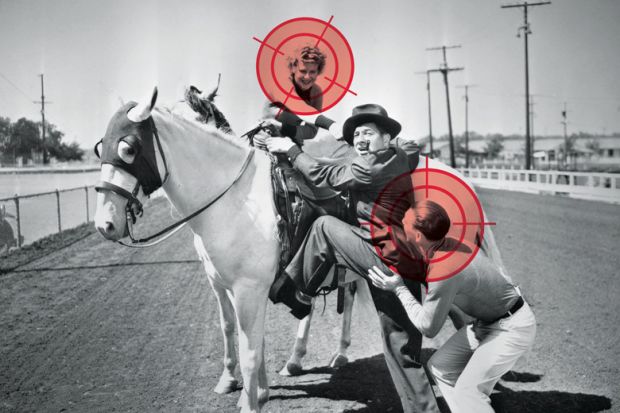 Man being helped to mount a white horse