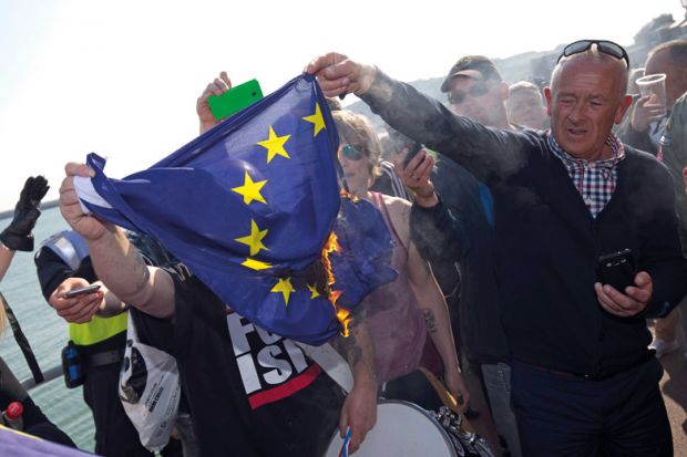 Man burning European Union (EU) flag Man burning European Union (EU) flag