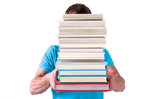 b Man carrying pile of books with face hidden