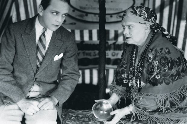 Man has his fortune told with a crystal ball Man has his fortune told with a crystal ball