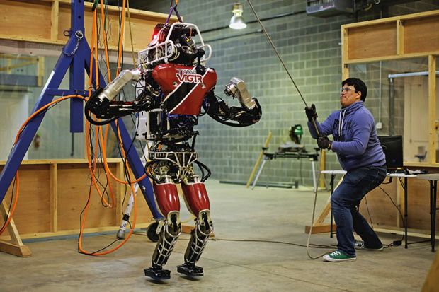 Man lifting robot for testing in preparation for the Defense Advanced Research Projects Agency (DARPA) robotic challenge Man lifting robot for testing in preparation for the Defense Advanced Research Projects Agency (DARPA) robotic challenge
