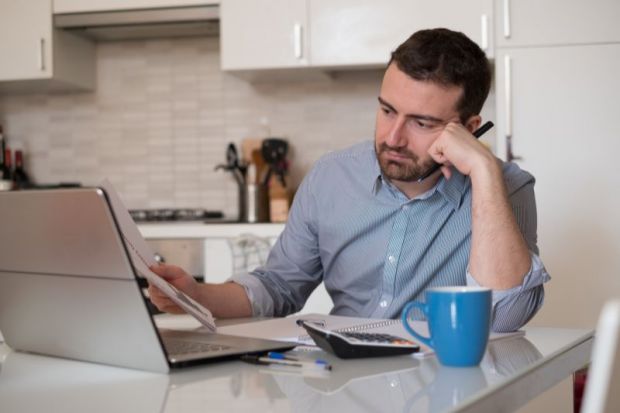 Man frustrated by paperwork