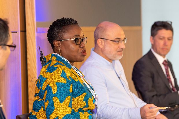 Arusha - Tanzania  March 2016 Safari guide looking at nearby elephant while drinking water in Lake Manyara National Park.