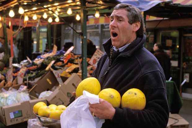 Market trader selling fruit, London Market trader selling fruit, London