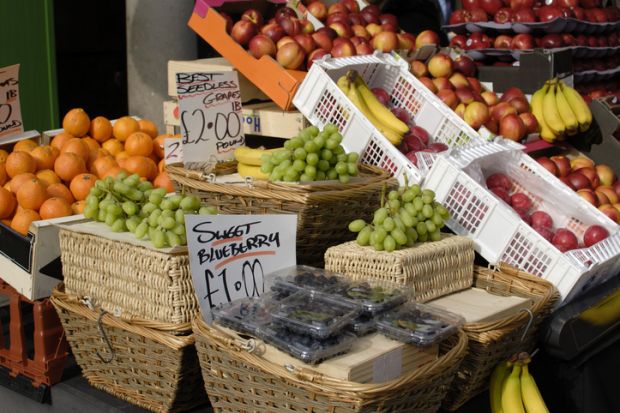 A fruit market with prices marked