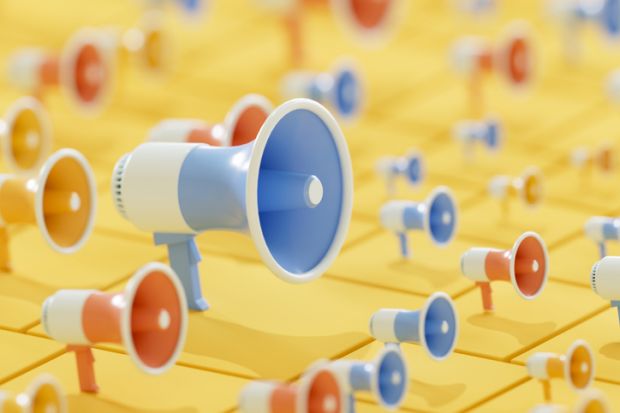 A large megaphone and small megaphones all pointing the same way, illustrating the risk that institutional positions impose conformity