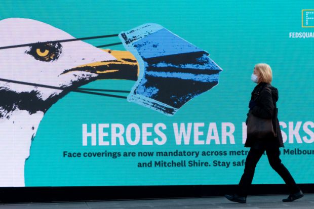 Melbourne Australia People wearing protective face masks in Melbourne which has just become mandatory for anyone in public.