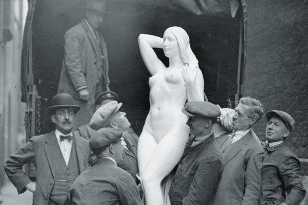 men-carrying-female-statue men-carrying-female-statue