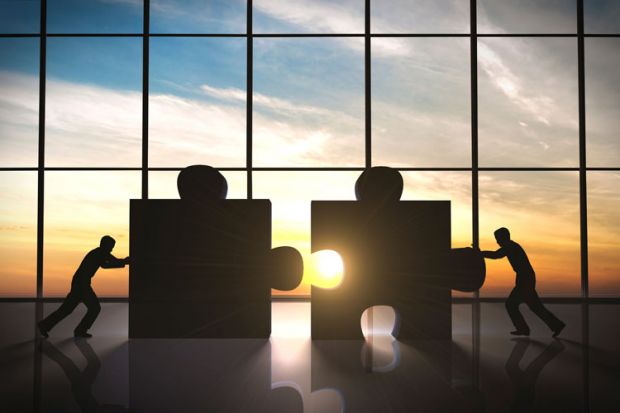 Merger: people joining jigsaw pieces Merger: people joining jigsaw pieces