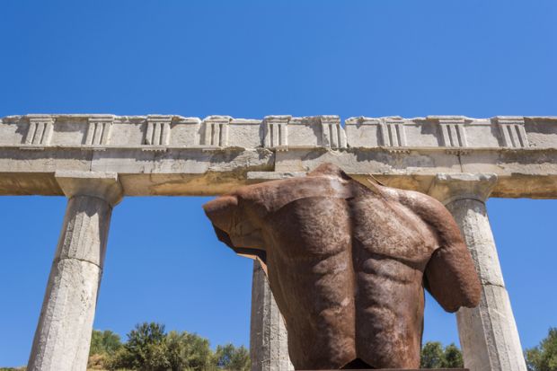 Metallic headless statue in the ancient Greek city of Messinia