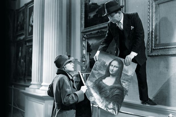 1940s-style woman and man holding the Mona Lisa 1940s-style woman and man holding the Mona Lisa