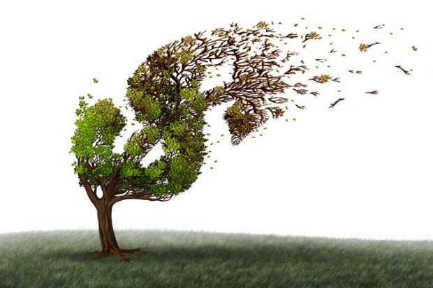 A tree in the shape of a dollar sign sheds its leaves